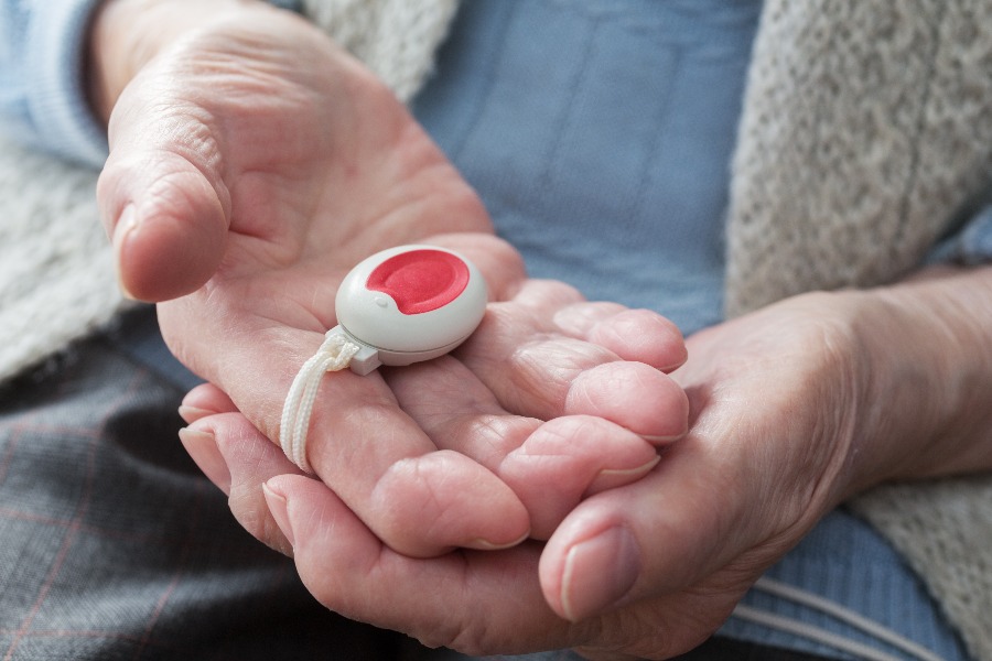 Elderly person with emergency button